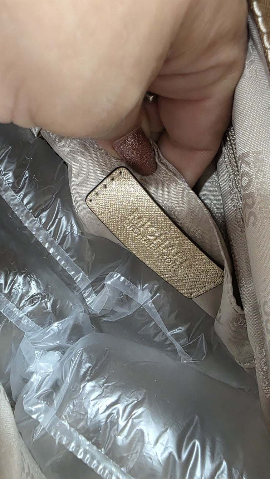 Etichetta originale Michael Kors all'interno della borsa