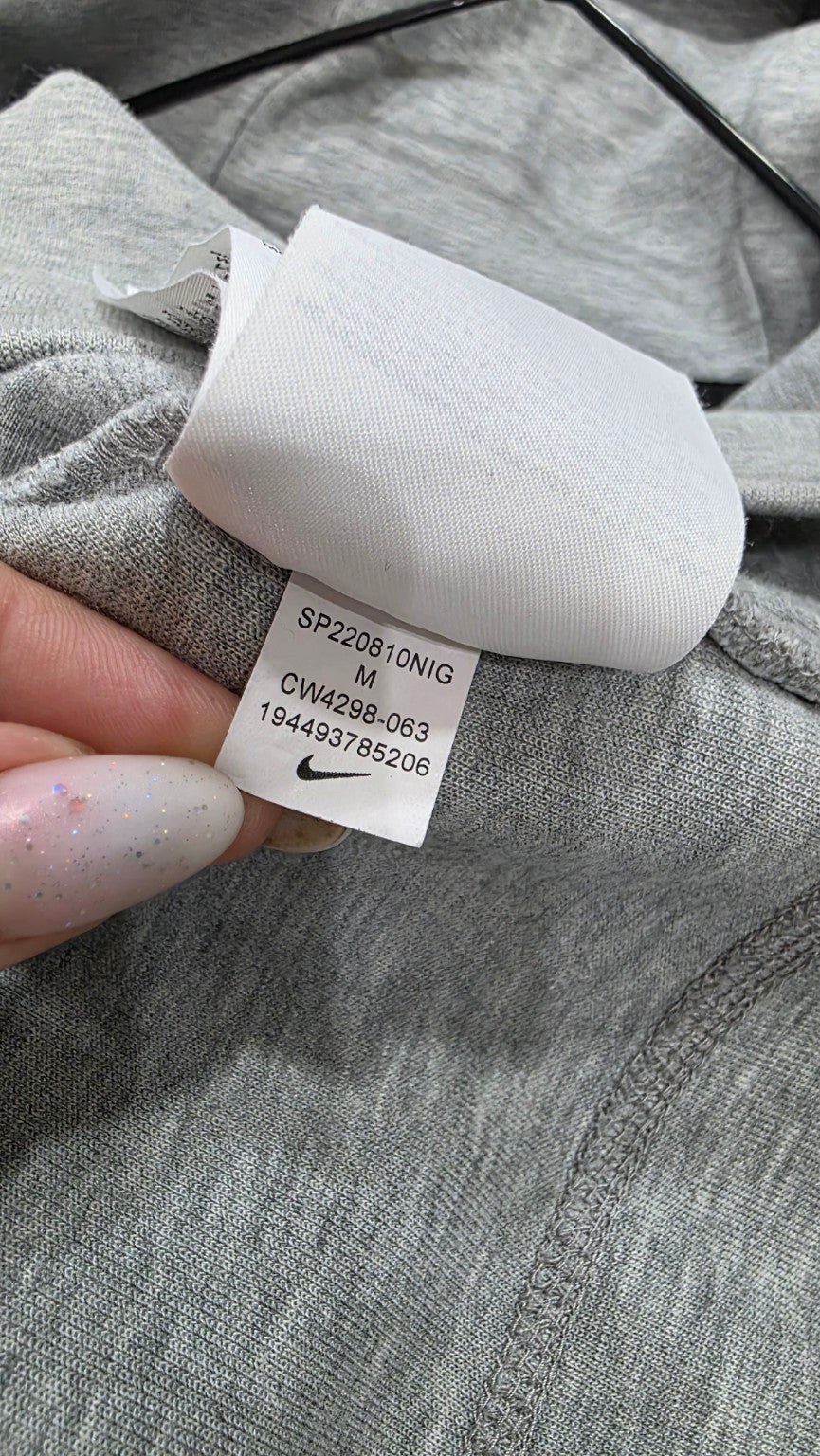 Etichetta originale Nike con composizione del tessuto