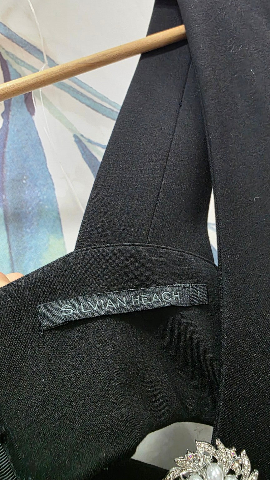 Etichetta Silvian Heach e taglia L dell'abito